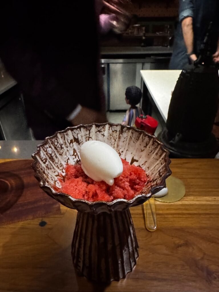 Salad was made with frost watermelon, tomato, strawberries, and basil, and was topped with a buffalo milk sorbet